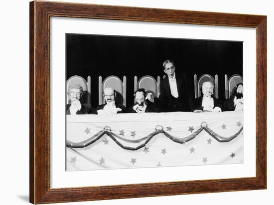 Man with Row of Seated Puppets-null-Framed Photo