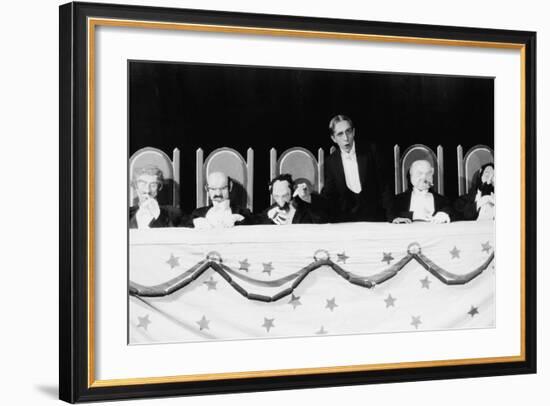 Man with Row of Seated Puppets-null-Framed Photo