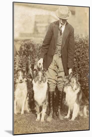 Man with Three Dogs in a Garden-null-Mounted Photographic Print
