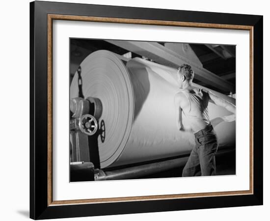 Man Working at Roller in Paper Factory-Margaret Bourke-White-Framed Photographic Print