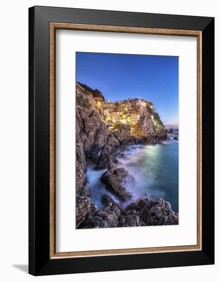 Manarola Village Illuminated by the Blue Light of Dusk with its Typical Pastel Colored Houses-ClickAlps-Framed Photographic Print