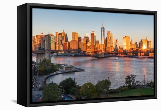 Manhattan, New York, USA. Sunrise view of Manhattan and the Brooklyn Bridge.-Emily Wilson-Framed Premier Image Canvas