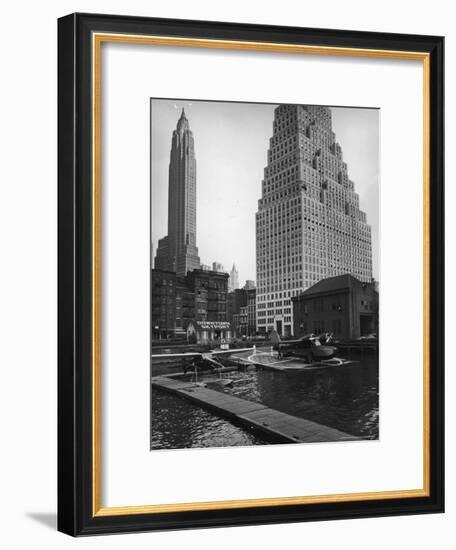 Manhattan's East River Downtown Skyport with Grumman and Fairchild Amphibious Planes-Margaret Bourke-White-Framed Premium Photographic Print