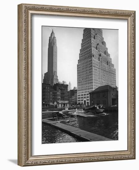 Manhattan's East River Downtown Skyport with Grumman and Fairchild Amphibious Planes-Margaret Bourke-White-Framed Photographic Print