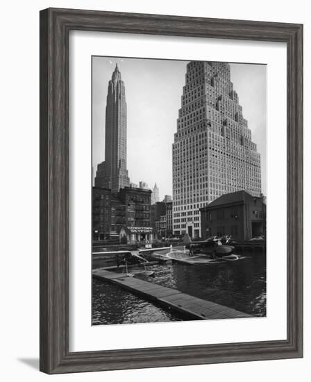 Manhattan's East River Downtown Skyport with Grumman and Fairchild Amphibious Planes-Margaret Bourke-White-Framed Photographic Print