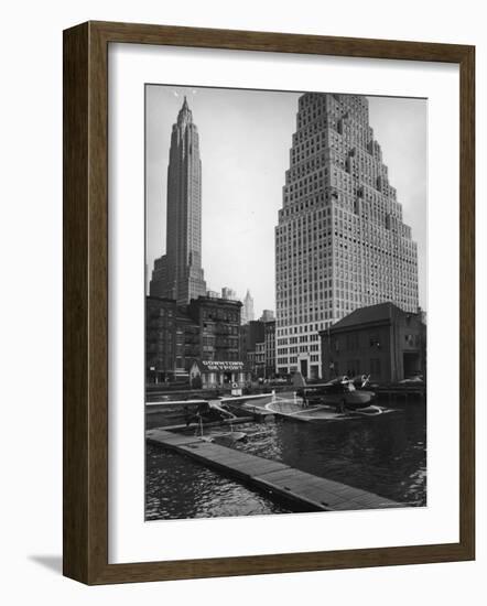 Manhattan's East River Downtown Skyport with Grumman and Fairchild Amphibious Planes-Margaret Bourke-White-Framed Photographic Print