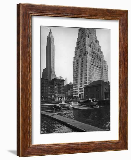 Manhattan's East River Downtown Skyport with Grumman and Fairchild Amphibious Planes-Margaret Bourke-White-Framed Photographic Print