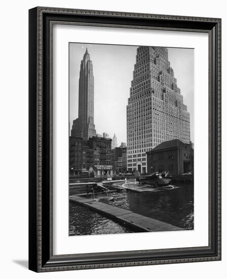 Manhattan's East River Downtown Skyport with Grumman and Fairchild Amphibious Planes-Margaret Bourke-White-Framed Photographic Print