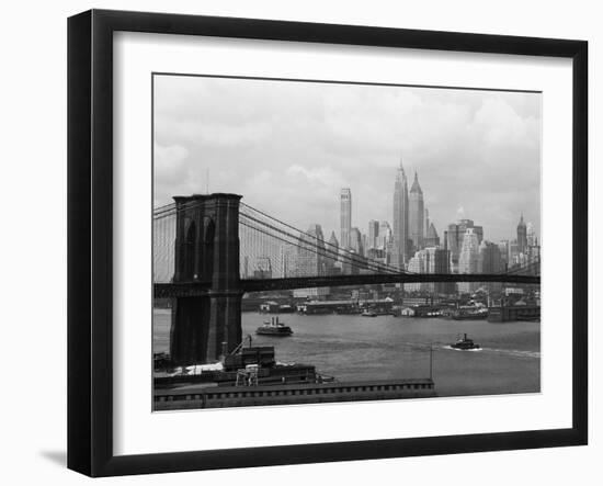 Manhattan Skyline And Brooklyn Bridge-Bettmann-Framed Photographic Print