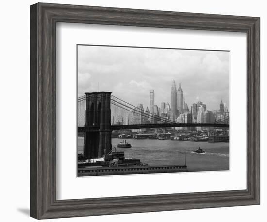 Manhattan Skyline And Brooklyn Bridge-Bettmann-Framed Photographic Print