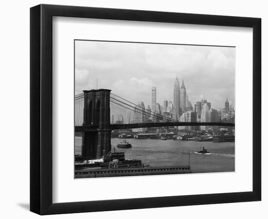 Manhattan Skyline And Brooklyn Bridge-Bettmann-Framed Photographic Print