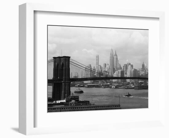 Manhattan Skyline And Brooklyn Bridge-Bettmann-Framed Photographic Print