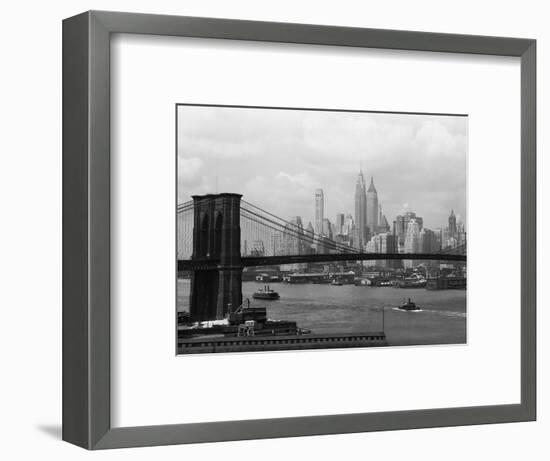 Manhattan Skyline And Brooklyn Bridge-Bettmann-Framed Photographic Print