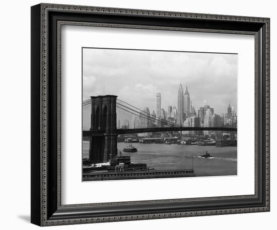 Manhattan Skyline And Brooklyn Bridge-Bettmann-Framed Photographic Print