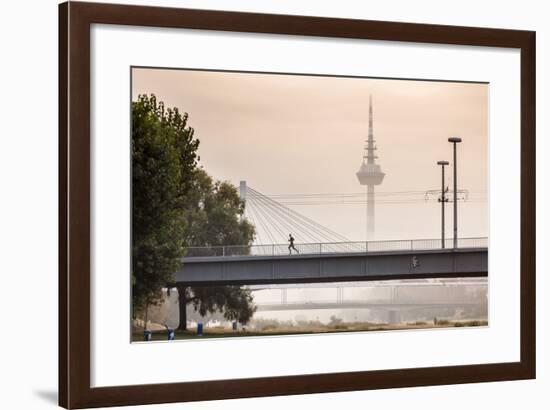 Mannheim, Baden-Württemberg, GER: Male Running Over Bridge Crossing River Neckar On Foggy Morning-Axel Brunst-Framed Photographic Print