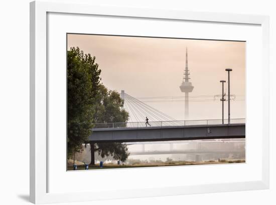 Mannheim, Baden-Württemberg, GER: Male Running Over Bridge Crossing River Neckar On Foggy Morning-Axel Brunst-Framed Photographic Print