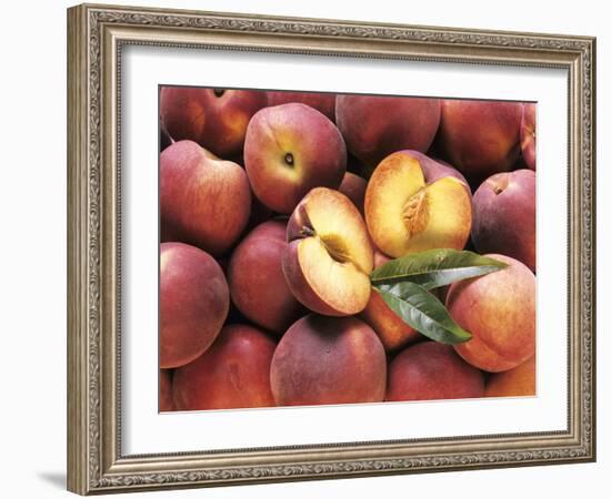 Many Whole Peaches with One Halved-null-Framed Photographic Print