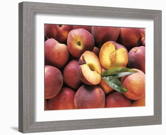 Many Whole Peaches with One Halved-null-Framed Photographic Print