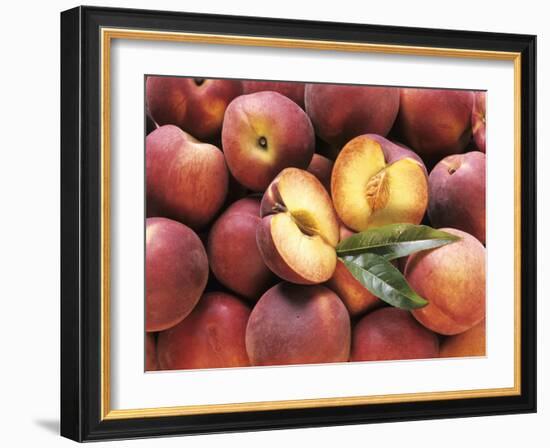 Many Whole Peaches with One Halved-null-Framed Photographic Print