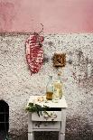 Raw Pork Ribs Hanging on the Wall of a House, Next to a A Gold-Framed Picture-Maria Brinkop-Mounted Photographic Print