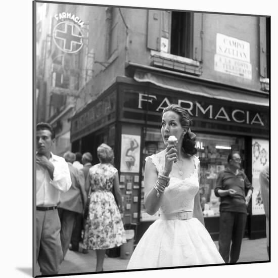 Maria Félix Eating an Ice Cream in Front of a Pharmacy-null-Mounted Photographic Print