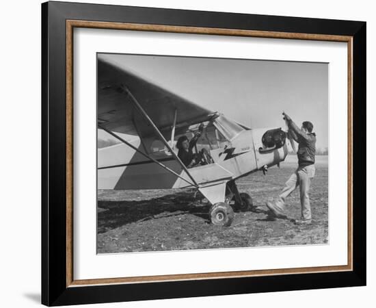 Marie Goerke Sitting in the Plane While the Instructor Kenny Garofalo Stops the Propellor-Bernard Hoffman-Framed Photographic Print