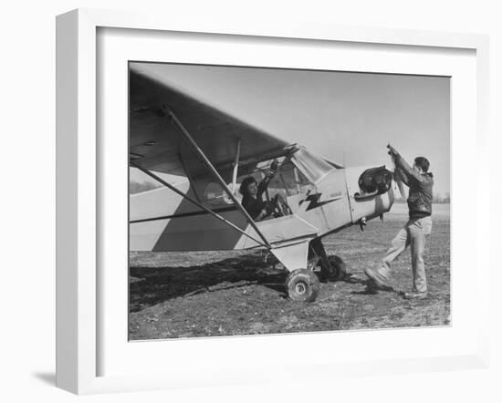 Marie Goerke Sitting in the Plane While the Instructor Kenny Garofalo Stops the Propellor-Bernard Hoffman-Framed Photographic Print