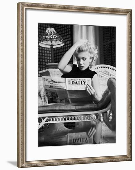 Marilyn Monroe Reading Motion Picture Daily, New York, c.1955-Ed Feingersh-Framed Art Print