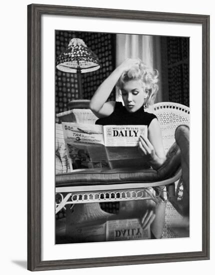 Marilyn Monroe Reading Motion Picture Daily, New York, c.1955-Ed Feingersh-Framed Art Print