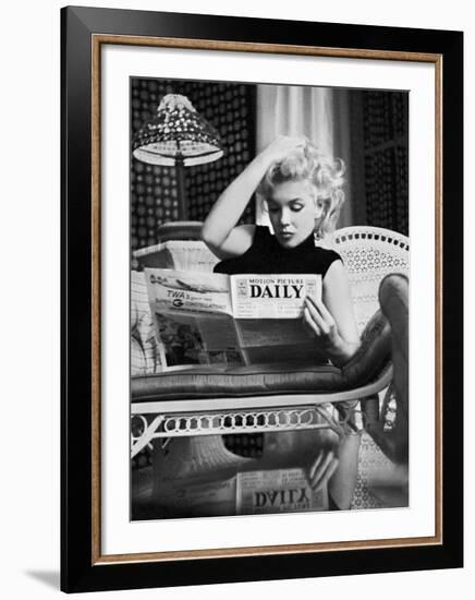 Marilyn Monroe Reading Motion Picture Daily, New York, c.1955-Ed Feingersh-Framed Art Print