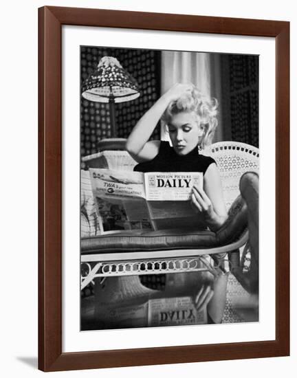 Marilyn Monroe Reading Motion Picture Daily, New York, c.1955-Ed Feingersh-Framed Art Print