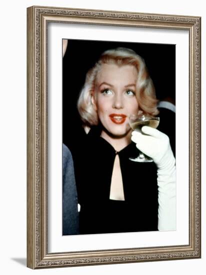 Marilyn Monroe with a Glass of Champagne, 1955-null-Framed Photo