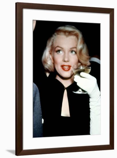 Marilyn Monroe with a Glass of Champagne, 1955-null-Framed Photo