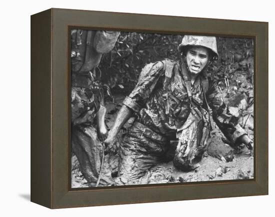 Marine Sinking Into Mud-Larry Burrows-Framed Premier Image Canvas