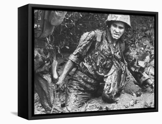 Marine Sinking Into Mud-Larry Burrows-Framed Premier Image Canvas