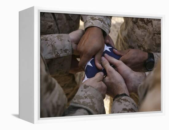 Marines Fold an American Flag after It was Raised in Memory of a Fallen Soldier-Stocktrek Images-Framed Premier Image Canvas