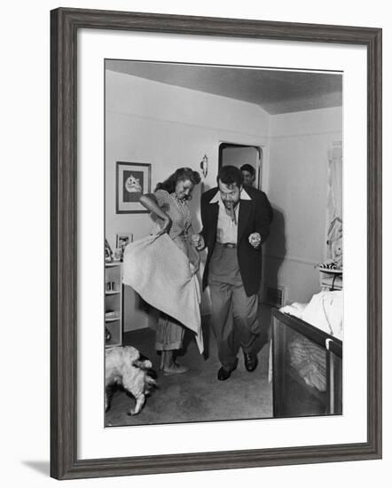 Married Actors Orson Welles and Rita Hayworth Pretending to Bullfight at Home-Peter Stackpole-Framed Premium Photographic Print