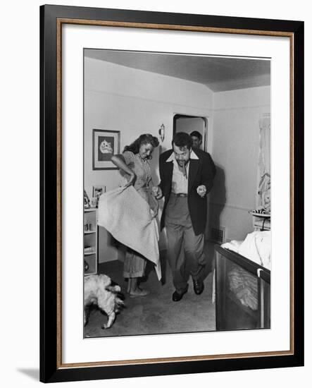 Married Actors Orson Welles and Rita Hayworth Pretending to Bullfight at Home-Peter Stackpole-Framed Premium Photographic Print