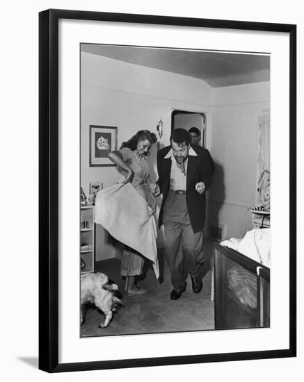 Married Actors Orson Welles and Rita Hayworth Pretending to Bullfight at Home-Peter Stackpole-Framed Premium Photographic Print