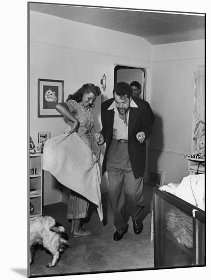 Married Actors Orson Welles and Rita Hayworth Pretending to Bullfight at Home-Peter Stackpole-Mounted Premium Photographic Print