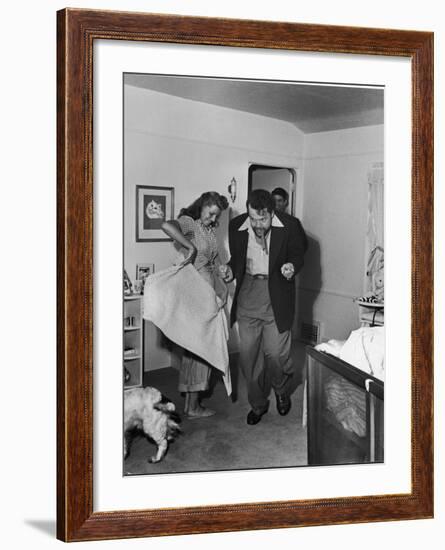 Married Actors Orson Welles and Rita Hayworth Pretending to Bullfight at Home-Peter Stackpole-Framed Premium Photographic Print