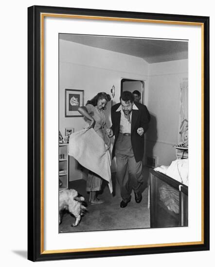 Married Actors Orson Welles and Rita Hayworth Pretending to Bullfight at Home-Peter Stackpole-Framed Premium Photographic Print