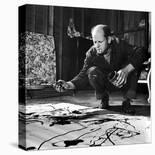 Painter Jackson Pollock Working in His Studio, Cigarette in Mouth, Dropping Paint Onto Canvas-Martha Holmes-Photographic Print