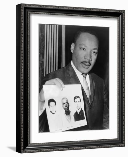 Martin Luther King Holding Photographs of Three Murdered Civil Rights Workers, 1964-null-Framed Photo