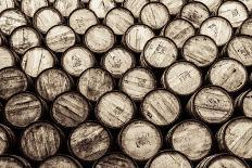 Stacked Pile of Old Whisky and Wine Wooden Barrels-MartinM303-Photographic Print