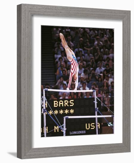 Mary Lou Retton on the Uneven Bars at the Los Angeles Olympic Games-null-Framed Photographic Print