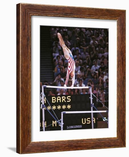 Mary Lou Retton on the Uneven Bars at the Los Angeles Olympic Games--Framed Photographic Print