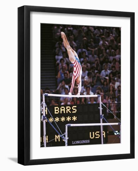 Mary Lou Retton on the Uneven Bars at the Los Angeles Olympic Games-null-Framed Photographic Print