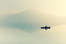 Fog over the Lake. Silhouette of Mountains in the Background. the Man Floats in a Boat with a Paddl-Maryna Patzen-Framed Photographic Print