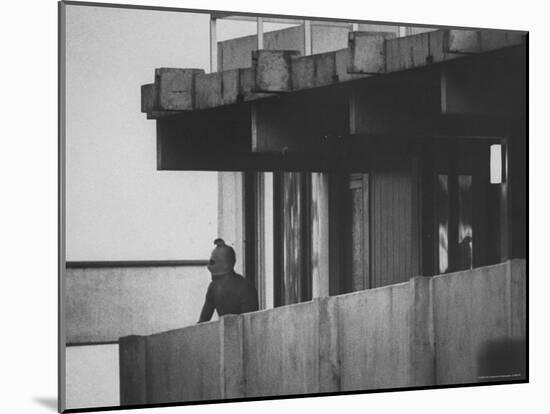 Masked Black September Arab Terrorist Looking from Balcony of Athletes Housing Complex-Co Rentmeester-Mounted Photographic Print